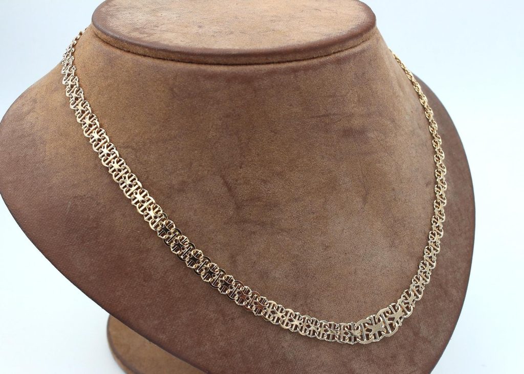 X-länk halsband med stavar i 18k guld- doserad