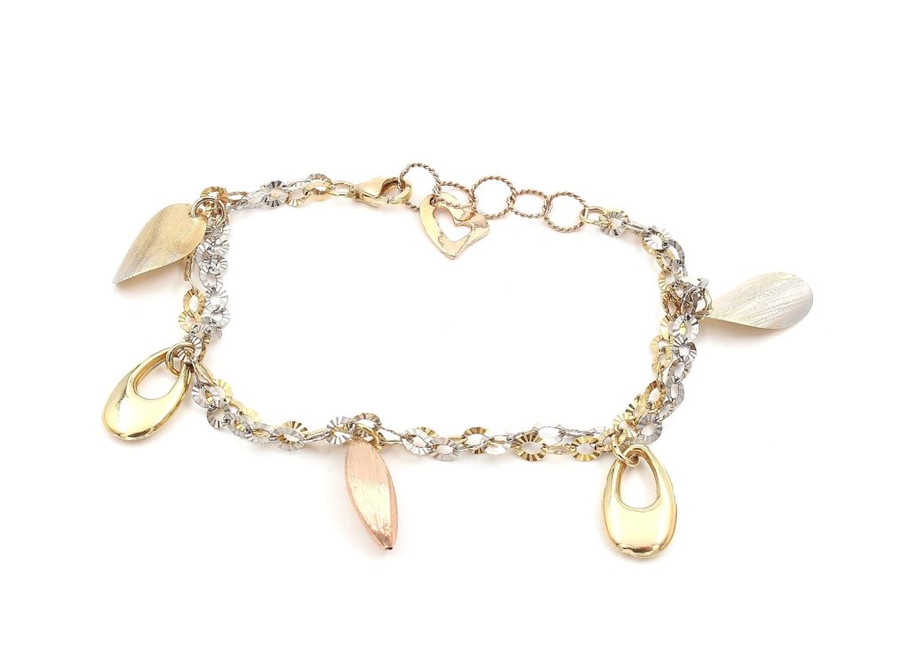 Armband i 18k guld, rose och vitguld med berlocker