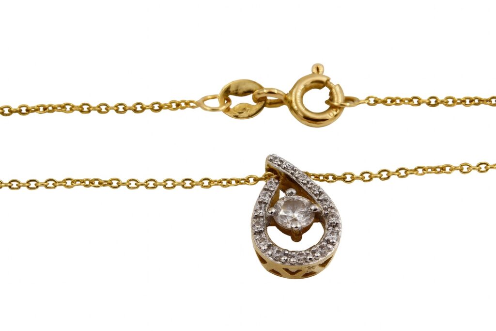 Halsband i 18k guld med ett zirkon hänge