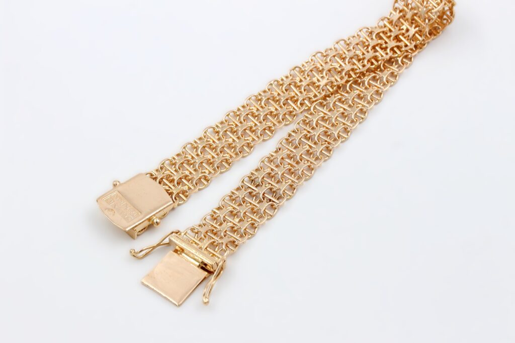 X-länk armband i 18k guld med stavar.vikt 17.43g X-länk armband i 18k guld med stavar.vikt 17.43g