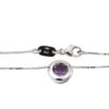 Halsband med ett hänge i 18k vitguld med en lila sten