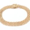 X-länk armband med stavar i 18k guld 3x. vikt: 13g