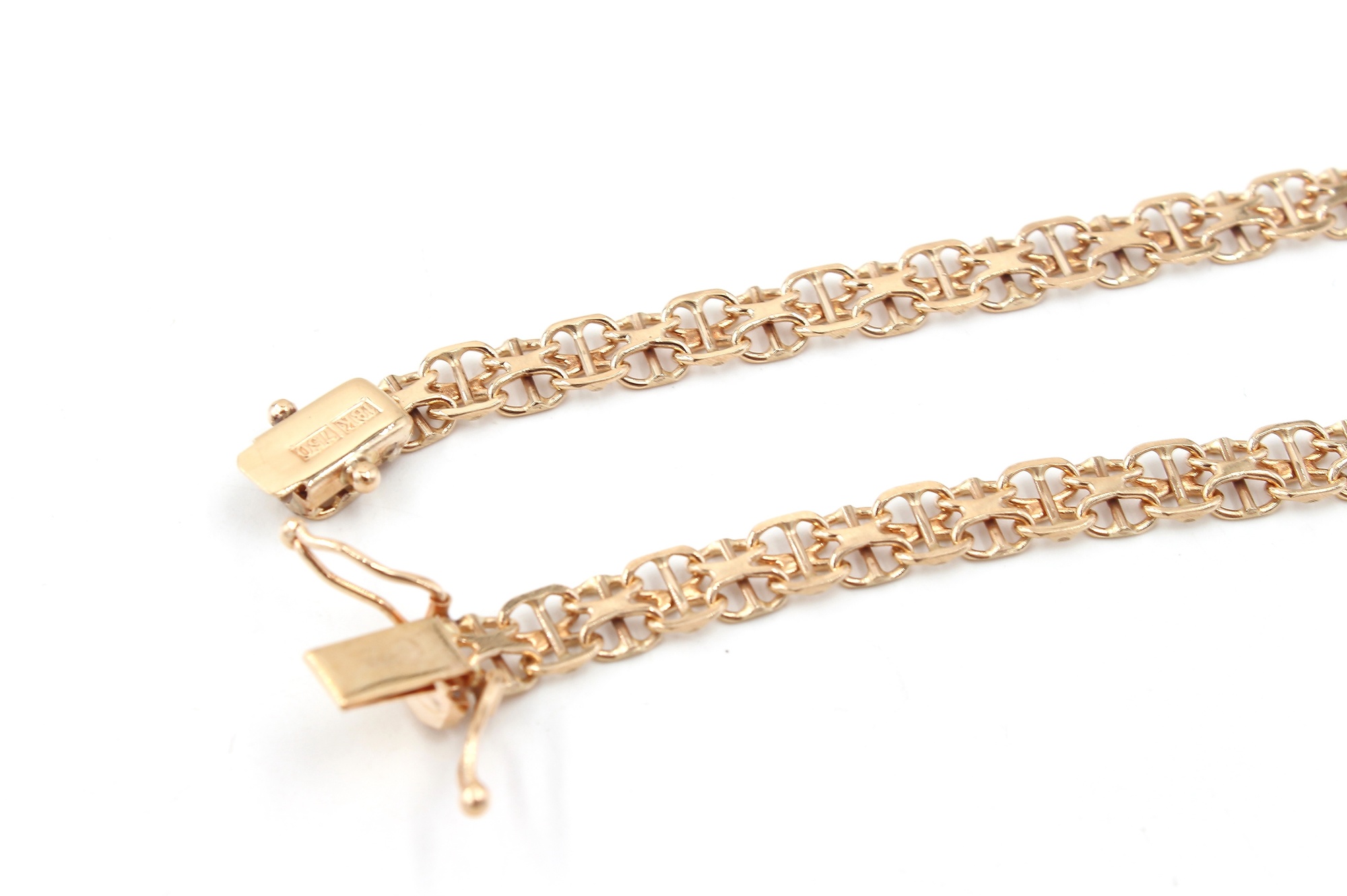 X-länk armband med stavar i 18k guld . vikt: 7,65g