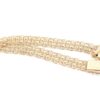X-länk armband med stavar i 18k guld.