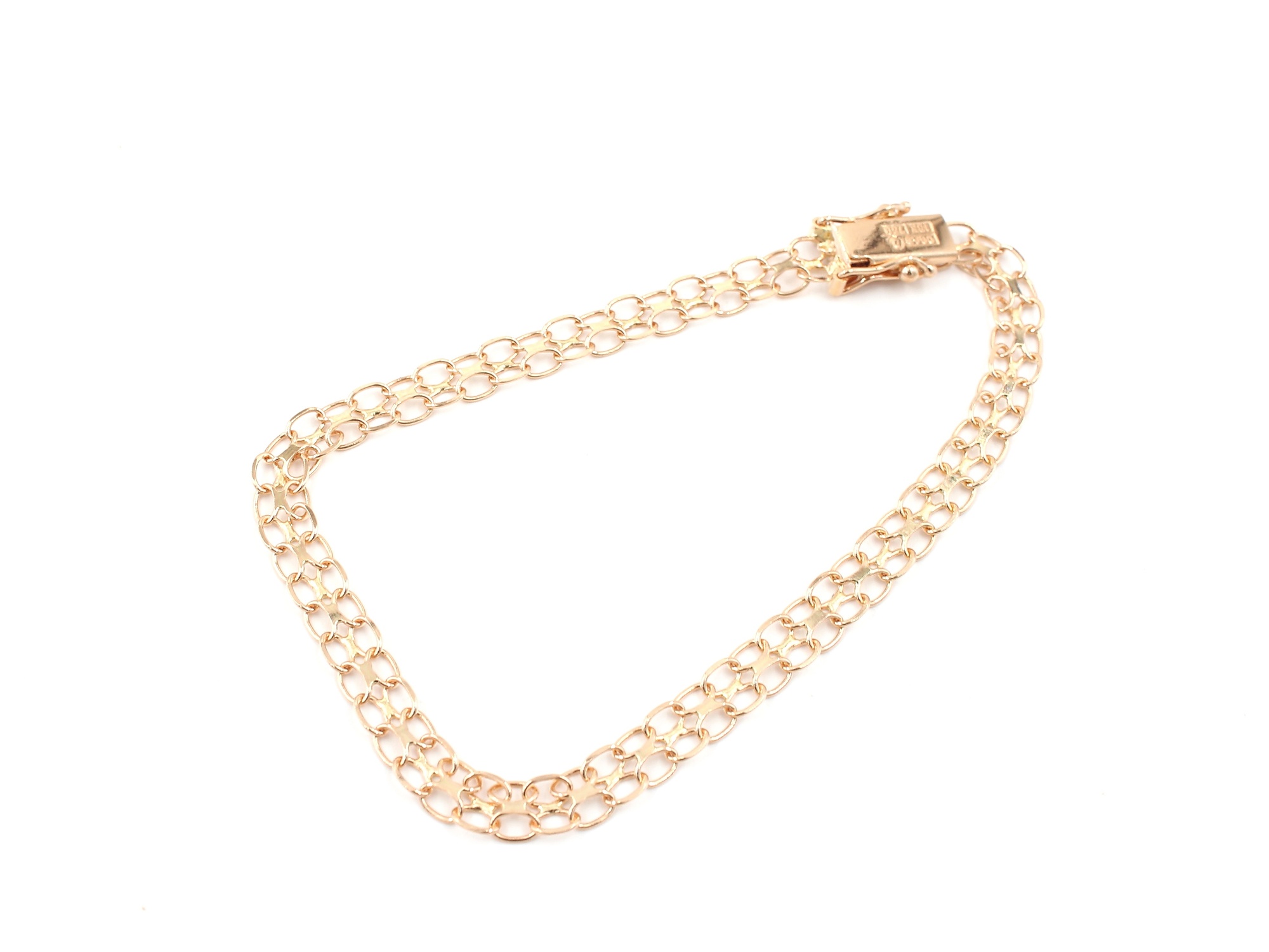X-länk armband i 18k guld . vikt: 4,49 g