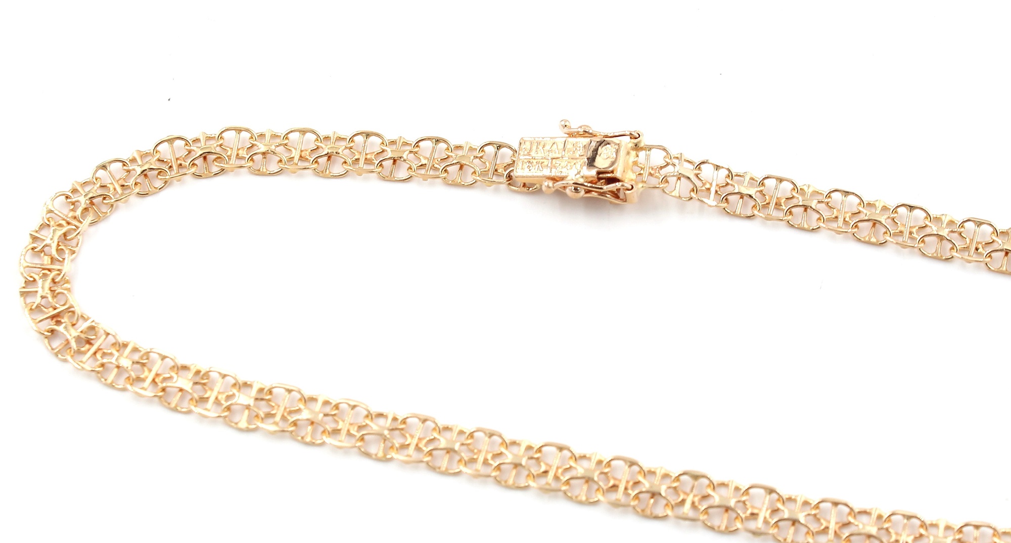 Halsband X-länk i 18k guld med stavar - doserad.Vikt 14.34