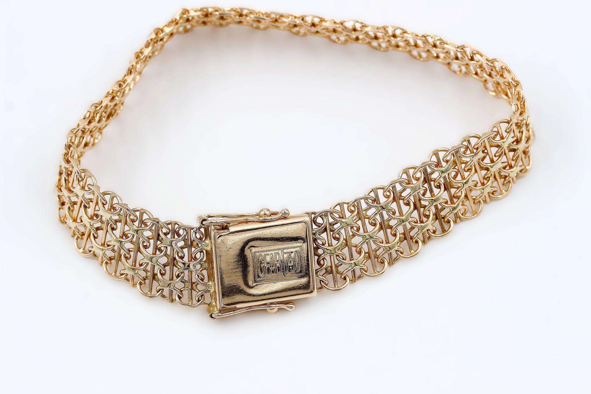 X-länk armband med stavar i 18k guld.Vikt 19.42g