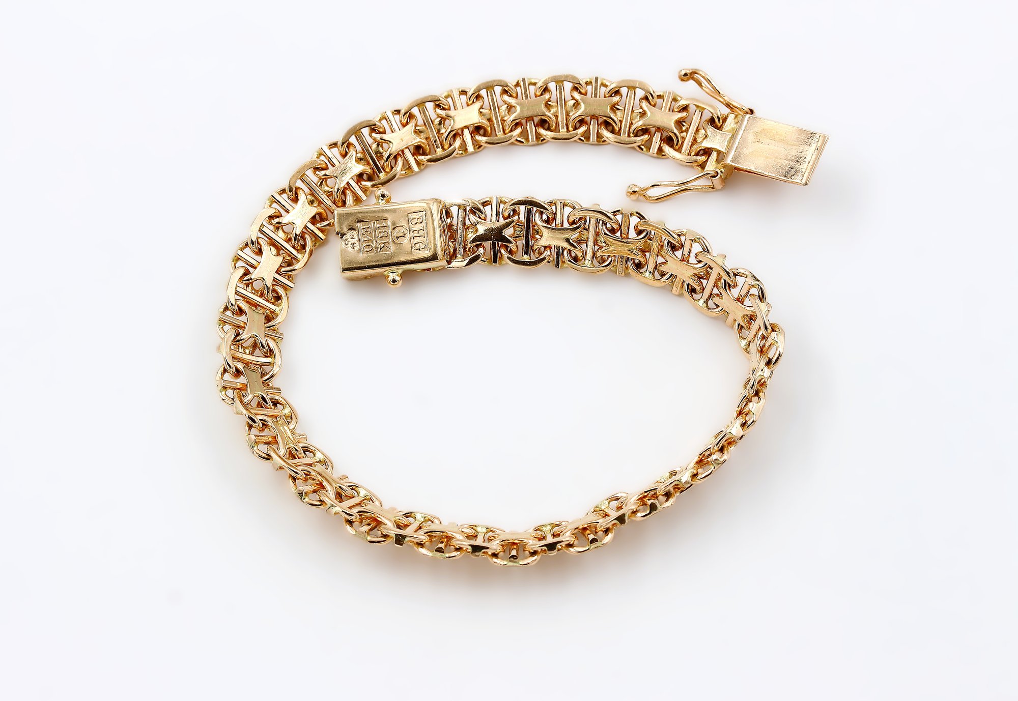 X-länk armband med stavar i 18k guld.Vikt: 16.13g