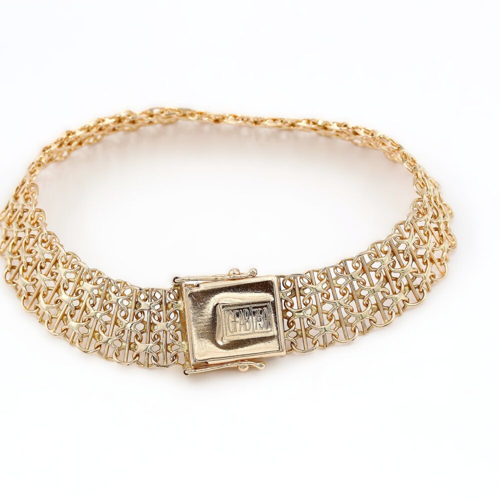 X-länk armband med stavar i 18k guld.Vikt 19.42g