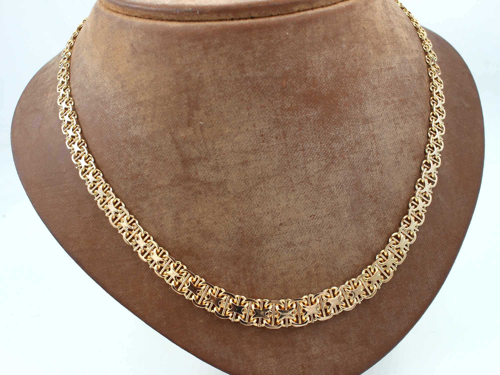 X-länk halsband med stavar i 18k guld. vikt: 25,3g