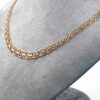 Halsband X-länk i 18k guld med stavar - doserad.Vikt 14.34