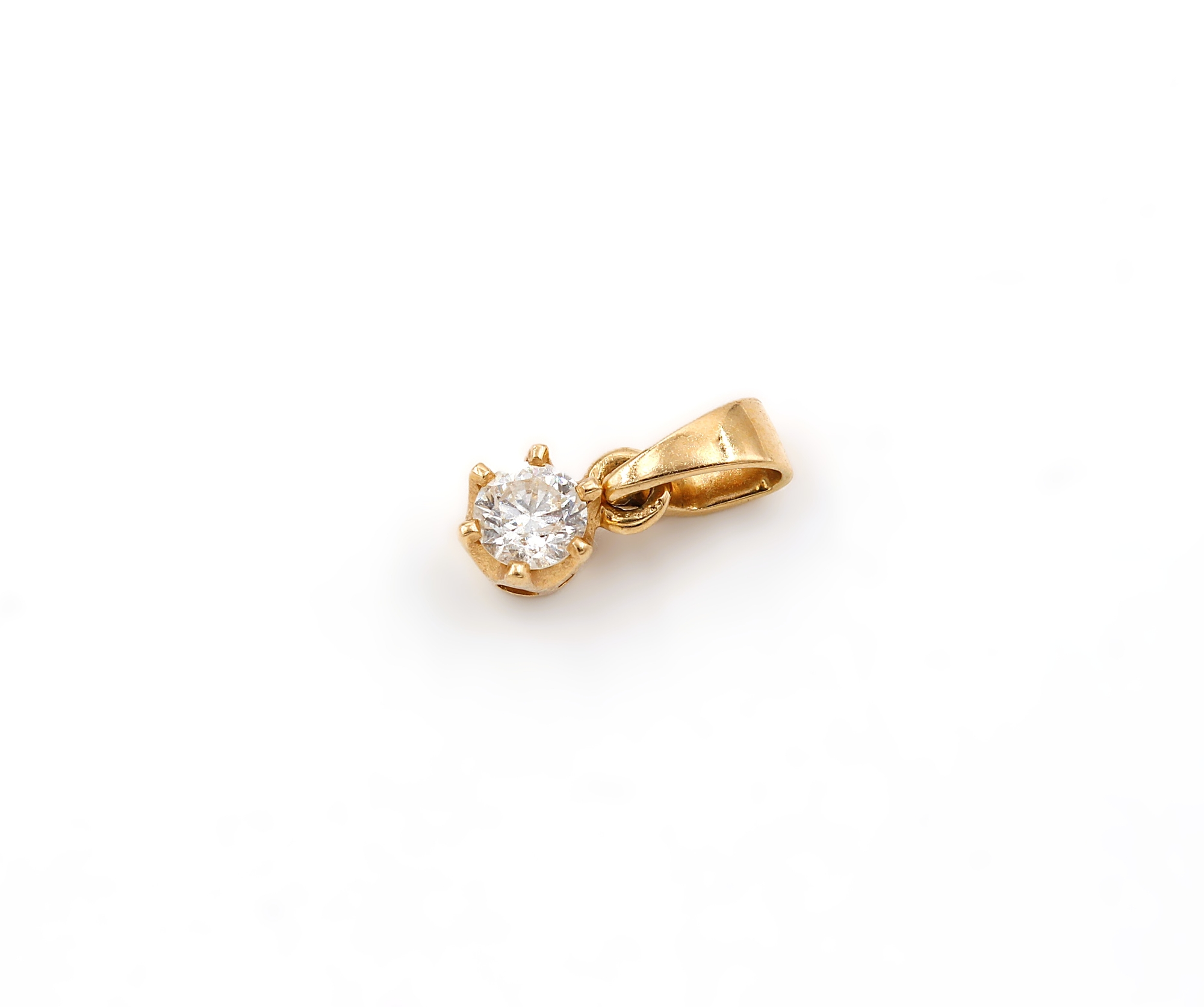 Hänge i 18k guld med en diamant på ca 0.2 ct.Vikt: 0.66g