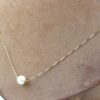 Halsband med pärla i 18k guld . vikt:1,35g