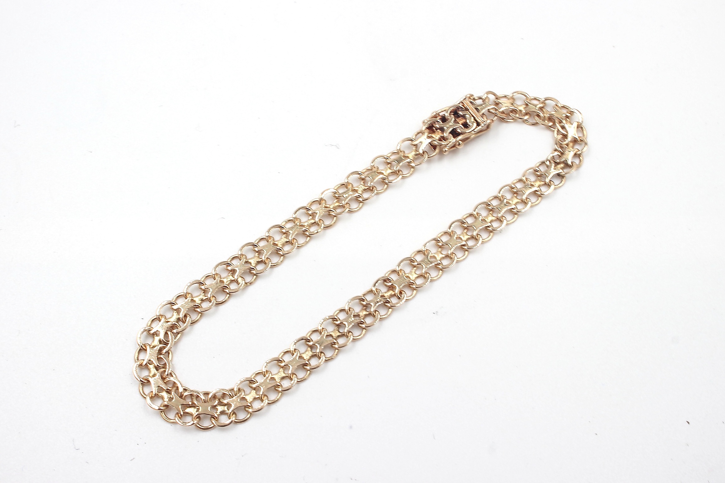 X-länk armband i 18k guld.