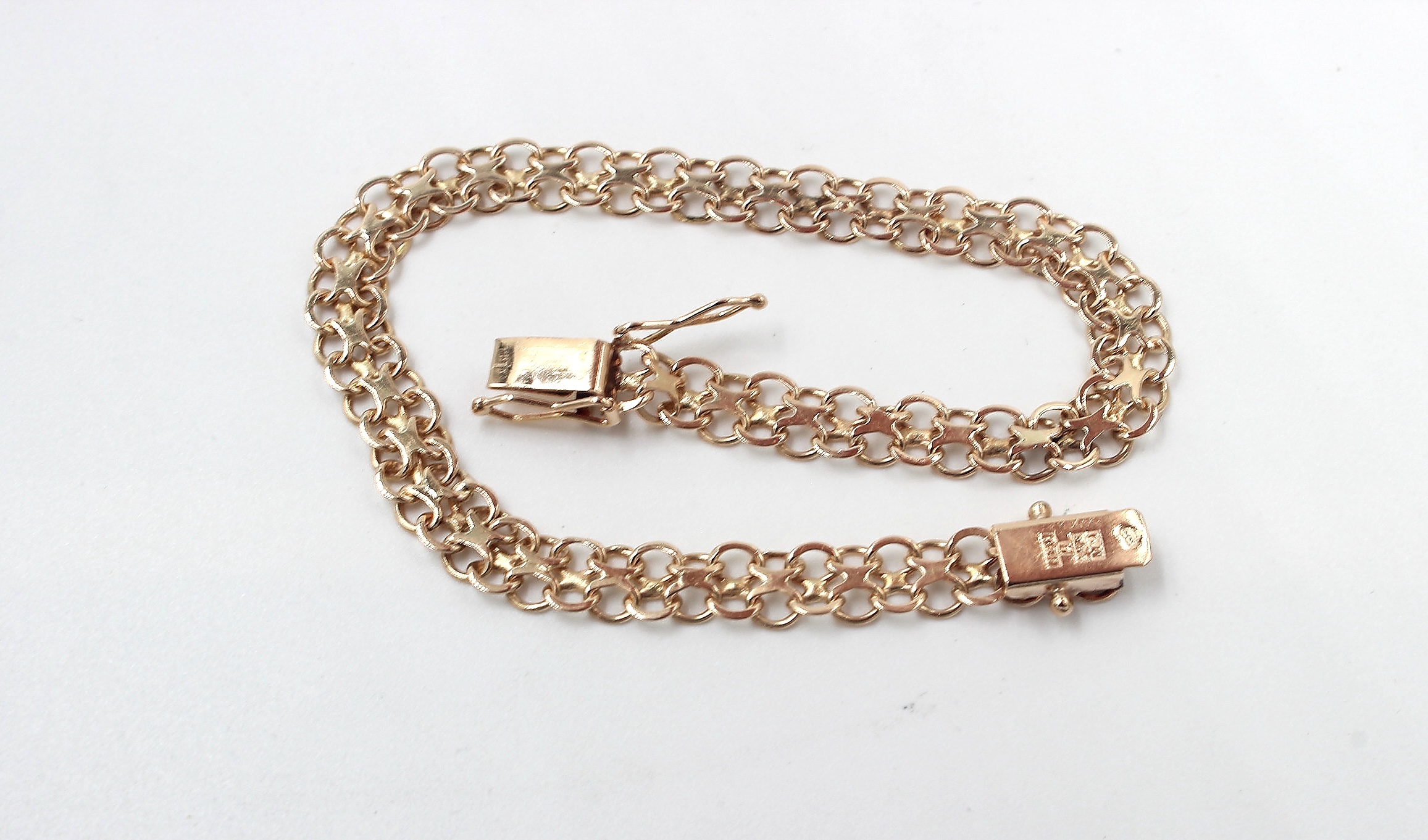 X-länk armband i 18k guld.