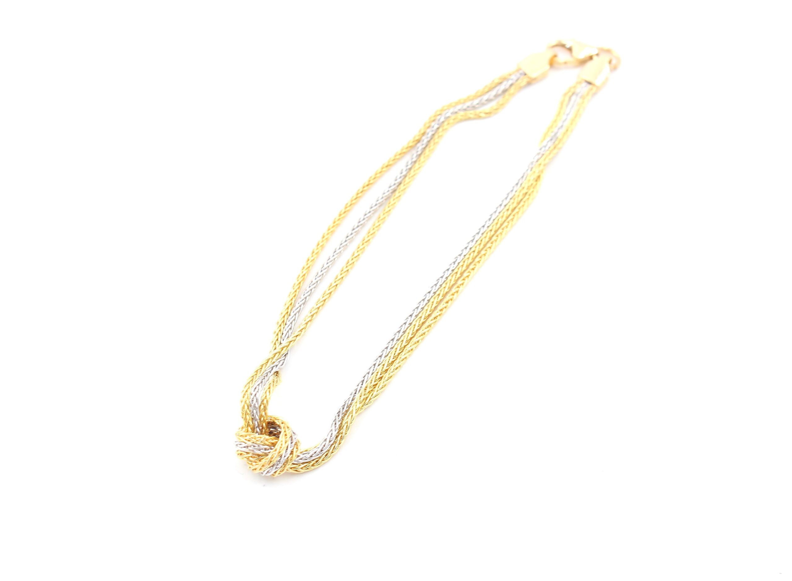 Armband i 18k guld och vitguld