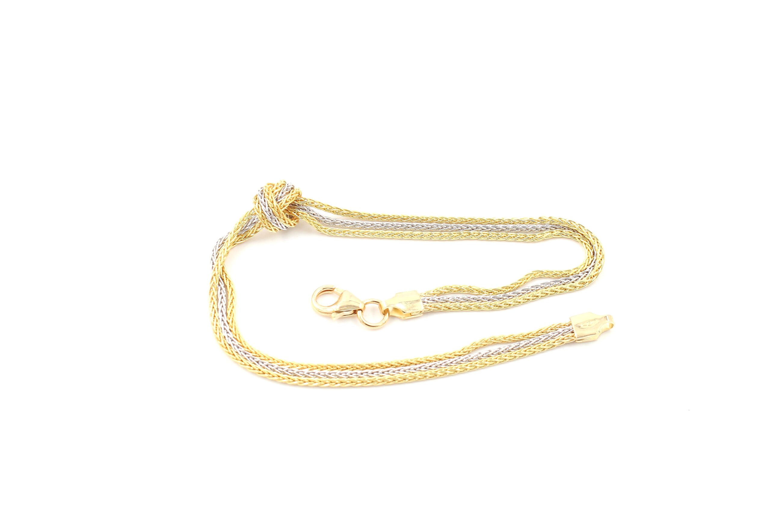 Armband i 18k guld och vitguld