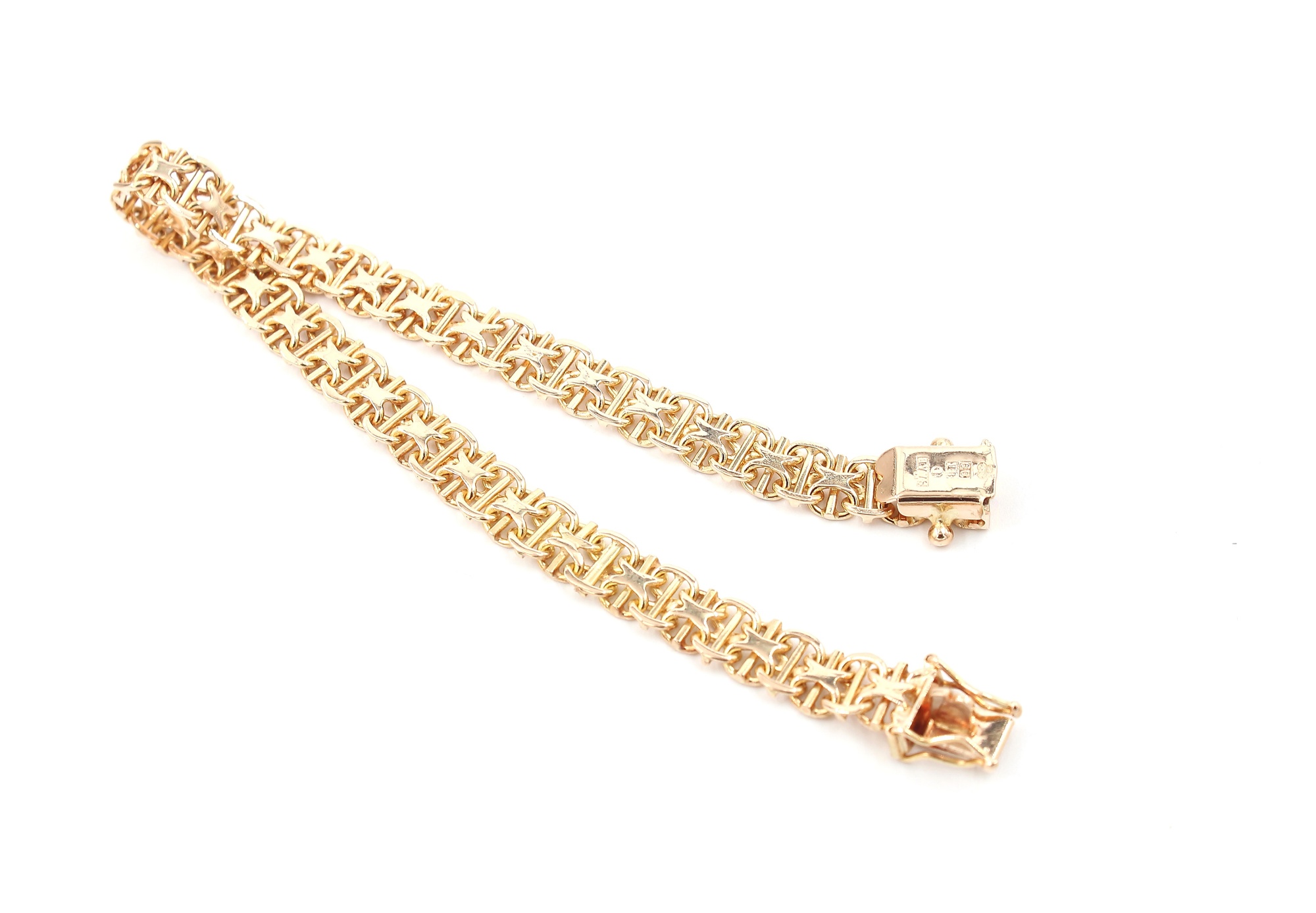 X-länk armband med stavar i 18k guld .vikt: 10,2g
