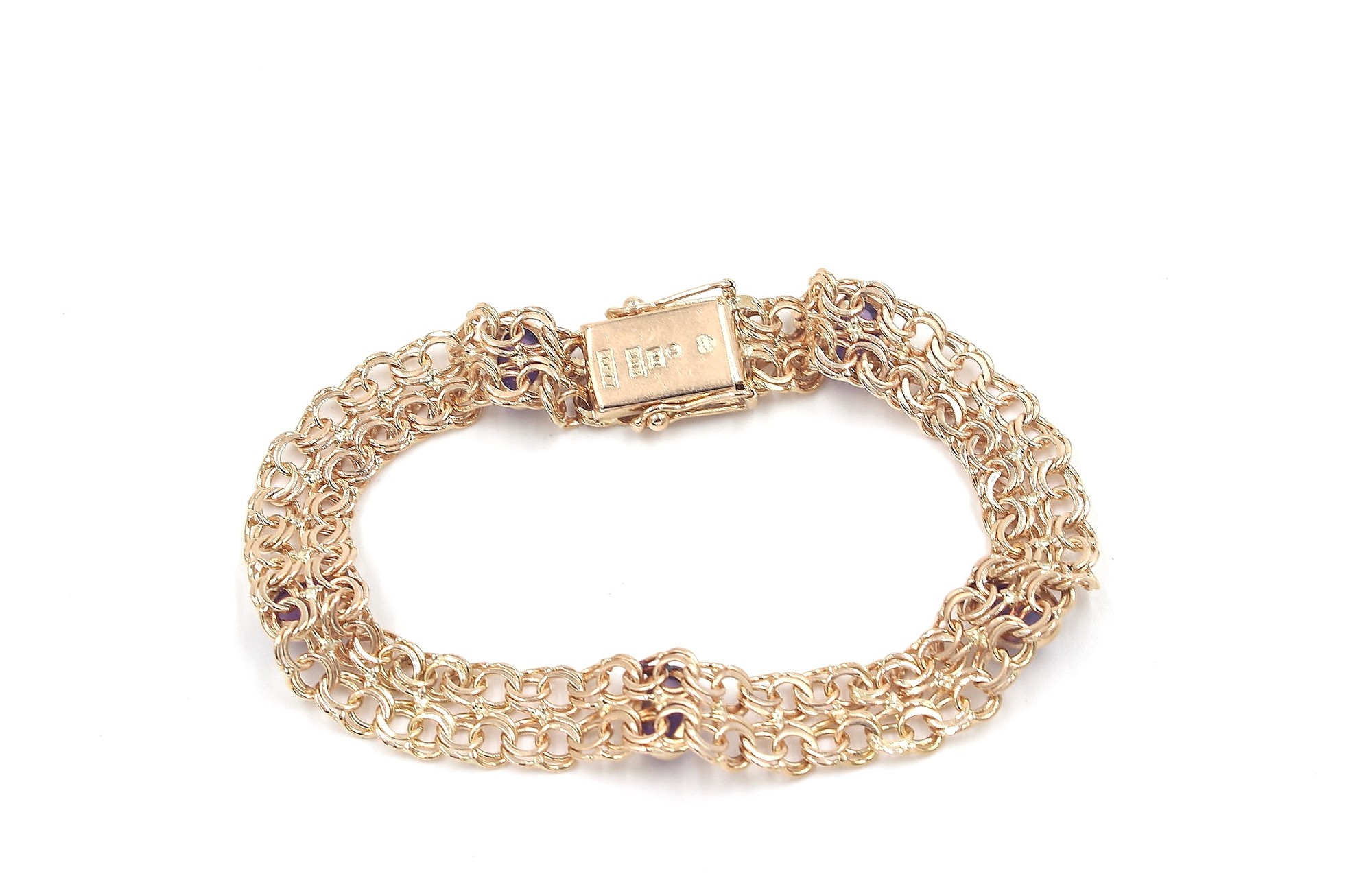 X-länk armband med ametister i 18k guld. vikt: 13,2 g