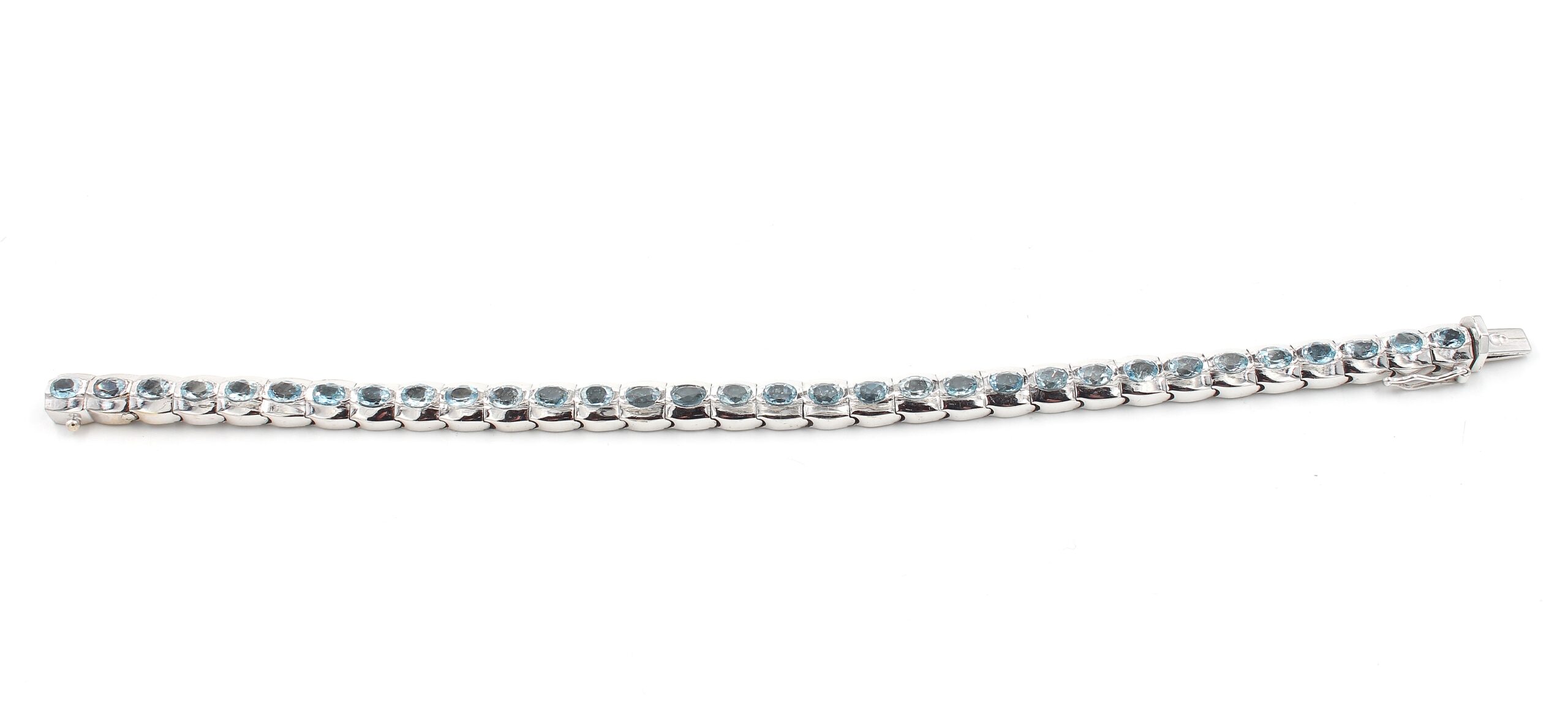 Armband i 18k vitguld med topaz stenar